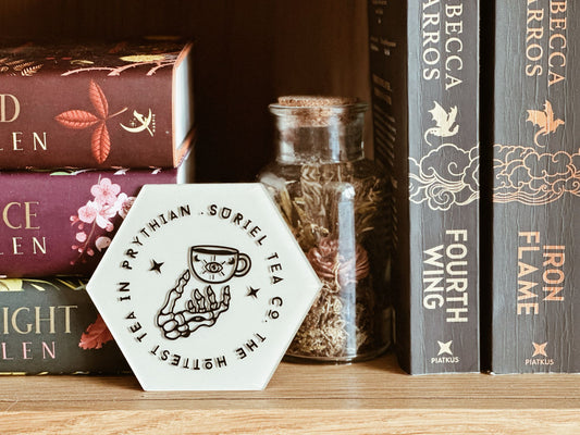 The Hottest Tea in Prythian fantasy coaster inspired by ACOTAR, featuring a playful tea design for book lovers and fans of magical, bookish home decor.